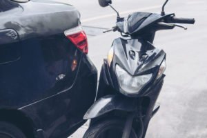 motorcycle collided with a car